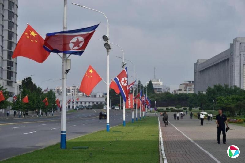 习近平同金正恩会谈 晚间出席欢迎宴会